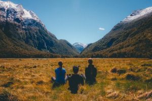 3 meditators in mountain